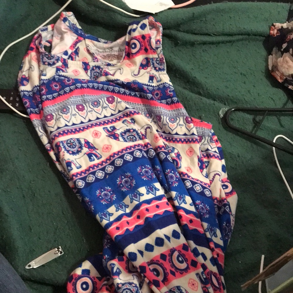 A dress with flowers symbols and elephants